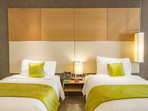 Habitación Doble Deluxe - 2 camas del hotel Mövenpick Du Lac Tunis. Foto 1