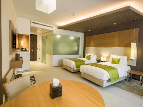 Habitación Doble Deluxe - 2 camas del hotel Mövenpick Du Lac Tunis. Foto 2