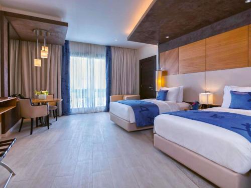 Habitación Doble Premium con vistas al lago - 2 camas del hotel Mövenpick Du Lac Tunis. Foto 2