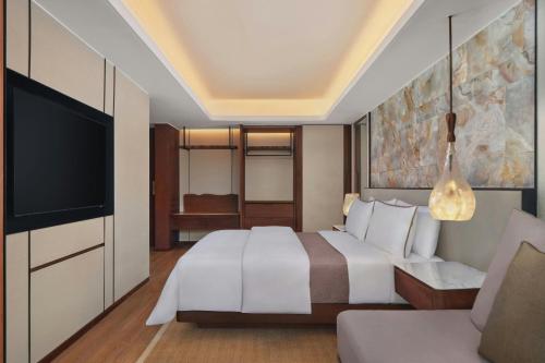 Deluxe King Garden View with Free Daily Resort Activities and Kids Amenities del hotel The Westin Resort Nusa Dua, Bali. Foto 1