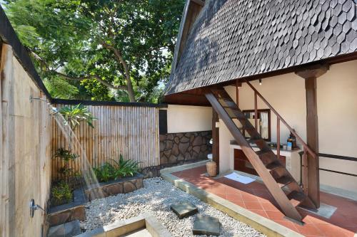 Habitación Doble Lumbung Hut del hotel Vila Ombak