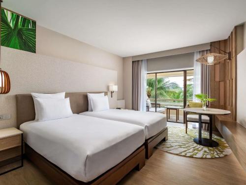 Habitación Deluxe con vistas al jardín - 2 camas del hotel Pullman Phuket Karon Beach Resort