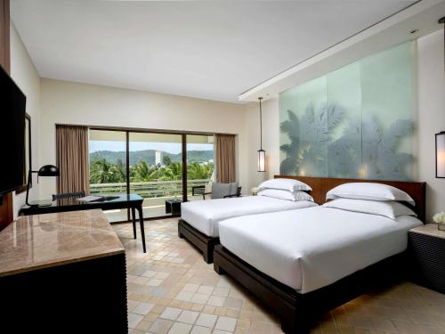 Habitación Doble Superior con vistas al jardín - 2 camas del hotel Pullman Phuket Karon Beach Resort. Foto 2