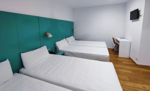 Habitación Cuádruple del hotel Yomo Hostal BCN Port. Foto 1