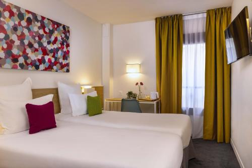 Habitación Twin Estándar del hotel Paris Louis Blanc. Foto 2