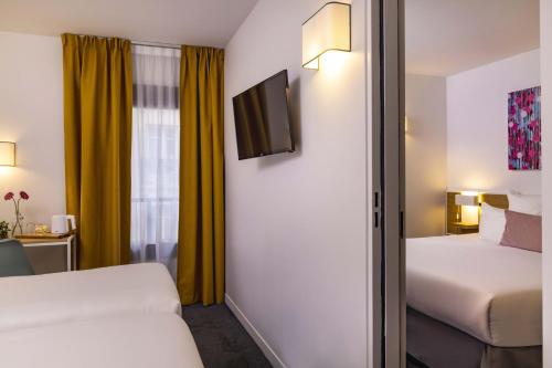 Habitación Twin Estándar del hotel Paris Louis Blanc. Foto 3