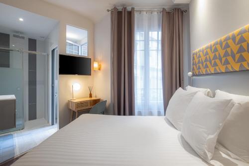 Habitación Doble Deluxe del hotel Makom Pereire. Foto 2