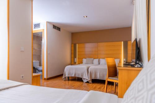 Habitación Triple del hotel Serrano