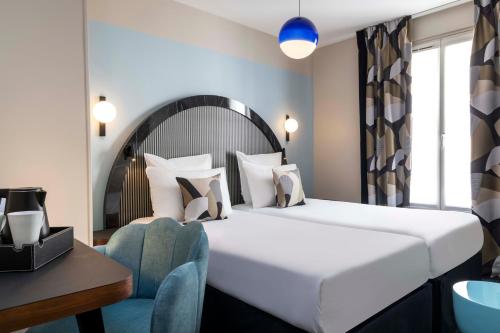 Habitación Doble Clásica del hotel Régina Opéra Grands Boulevards. Foto 8