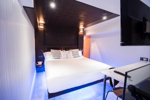 Habitación Cuádruple Dúplex del hotel Petit Palace President Castellana. Foto 1