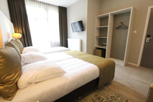 Habitación Triple Clásica del hotel Apple Inn. Foto 3