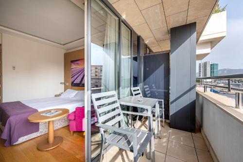 Habitación Doble con balcón del hotel Nelva. Foto 4