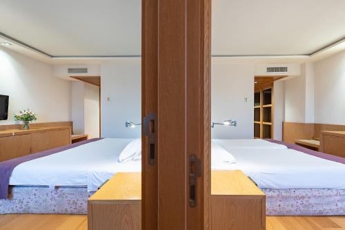 Habitación cuádruple del hotel Nelva. Foto 7
