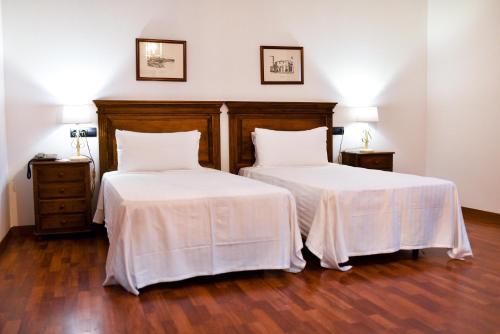 Habitación cuádruple 2 Camas individuales 1 Cama doble Normal del hotel The Place Bodega Real by ALEGRIA. Foto 3
