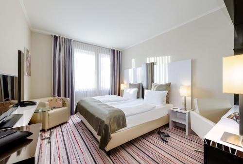 Habitación Estándar - Cama extragrande del hotel Mercure Wiesbaden City. Foto 6