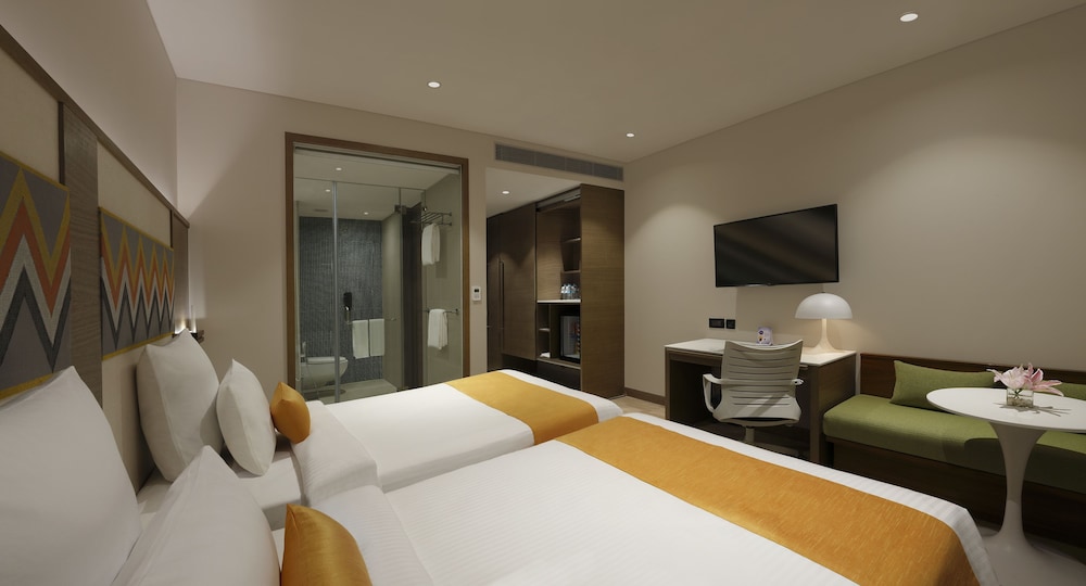 Habitación Ejecutiva con 2 Camas Individuales y horas de cóctel gratuitas de 18:00 a 20:00 h del hotel Novotel Guwahati Gs Road. Foto 1
