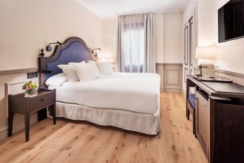 Habitación doble con vistas al patio - 2 camas del hotel H10 Corregidor Boutique. Foto 3