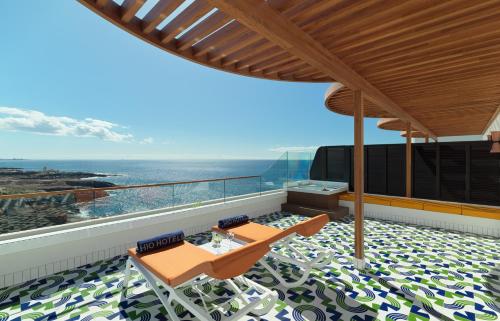 Suite Vista Mar Planta Alta Sofá Cama incluido 3 camas individuales del hotel H10 Atlantic Sunset Horizons Collection. Foto 7