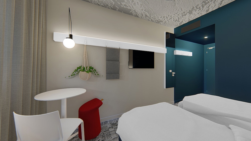 Habitación estándar con dos camas individuales del hotel Ibis Nantes Treillières. Foto 1