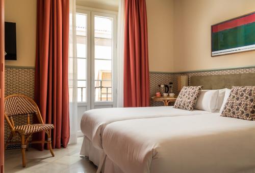 Habitación Triple Estándar del hotel BYPILLOW Abril. Foto 1