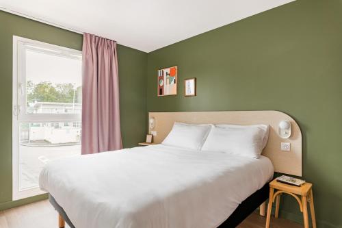 Habitación Pop con 1 cama doble del hotel greet Prévessin Genève Aéroport. Foto 6
