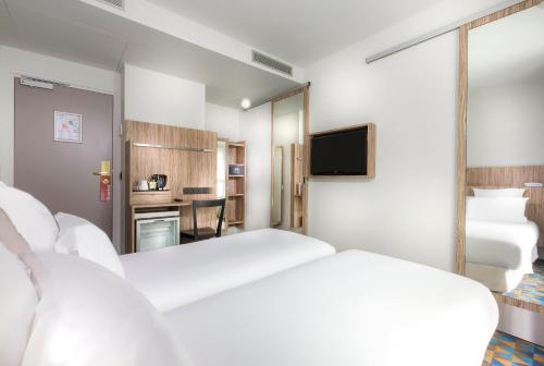 Habitación Doble Confort del hotel Libertel Gare Du Nord Suede. Foto 1