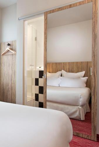 Habitación Doble Acogedora del hotel Libertel Gare Du Nord Suede. Foto 3