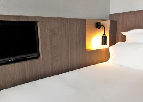 Habitación Individual acogedora del hotel Libertel Gare Du Nord Suede. Foto 1