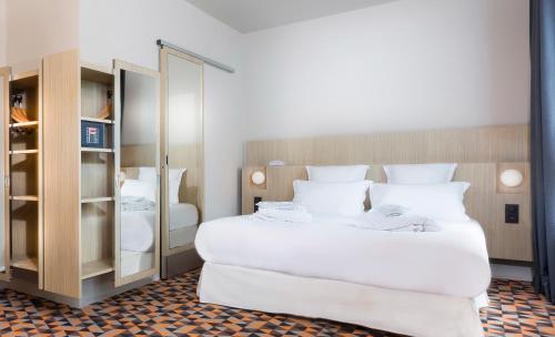 Habitación cuádruple del hotel Libertel Gare Du Nord Suede. Foto 1