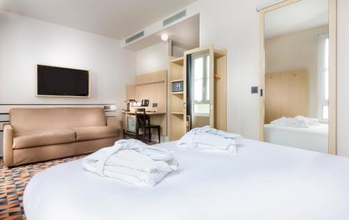 Habitación cuádruple del hotel Libertel Gare Du Nord Suede. Foto 2