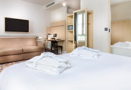 Habitación cuádruple del hotel Libertel Gare Du Nord Suede. Foto 3