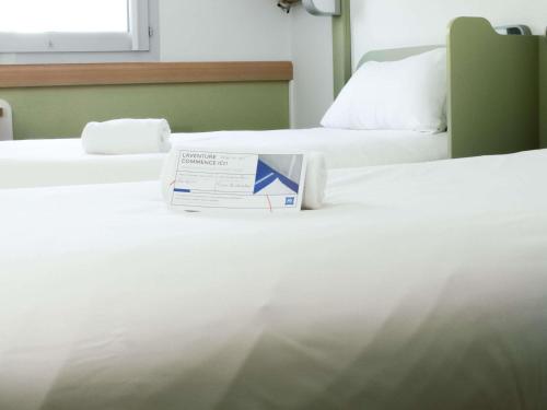 TWIN - Habitación con camas individuales del hotel Ibis Budget Saint-omer Centre. Foto 3