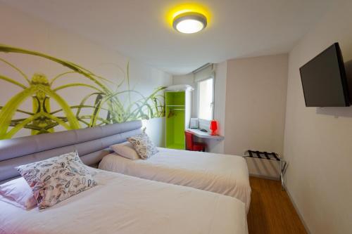Habitación doble con dos camas individuales o cama king size de 71 pulgadas - 180 cm del hotel Ibis Styles Saint-brieuc Gare Centre. Foto 11