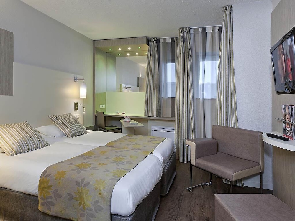 Habitación con camas individuales del hotel Ibis Styles Melun. Foto 2