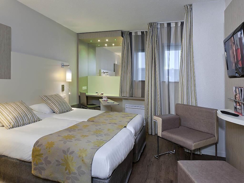 Habitación con camas individuales del hotel Ibis Styles Melun. Foto 3