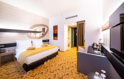 Habitación Doble Deluxe del hotel Grandium Prague. Foto 2