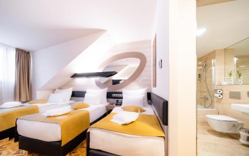Habitación Triple del hotel Grandium Prague. Foto 3