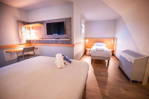 Habitación Familiar del hotel Ibis Budget Metz Sud Augny. Foto 1