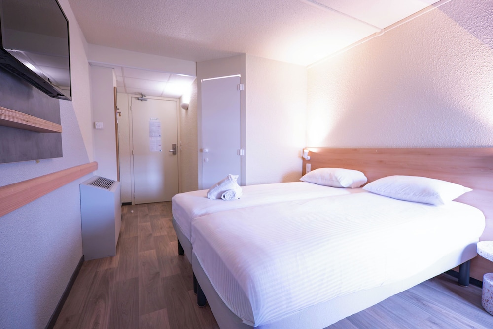 TWIN - Habitación con dos camas individuales del hotel Ibis Budget Metz Sud Augny. Foto 1