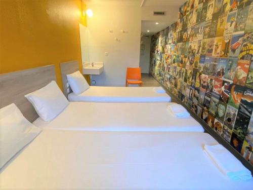 Habitación Break con 2 camas individuales y 1 cama supletoria del hotel Hotelf1 Paris Porte De Châtillon. Foto 6