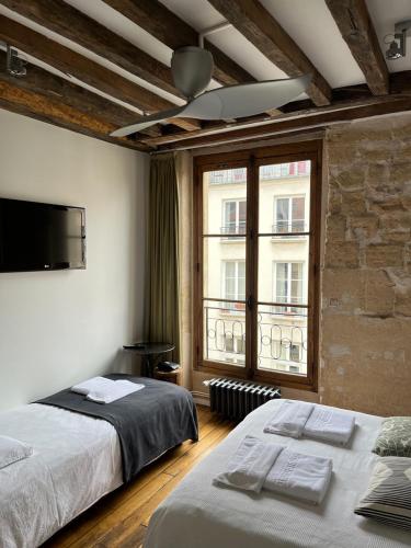 Habitación Triple del hotel Boutique Hôtel De La Place Des Vosges