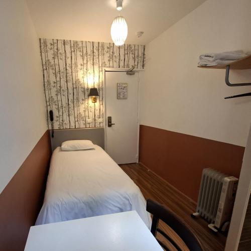 Habitación individual con aseo compartido del hotel Caulaincourt Montmartre By Hiphophostels. Foto 1