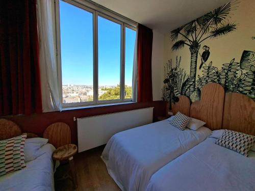 Habitación Triple Deluxe del hotel Caulaincourt Montmartre By Hiphophostels. Foto 2