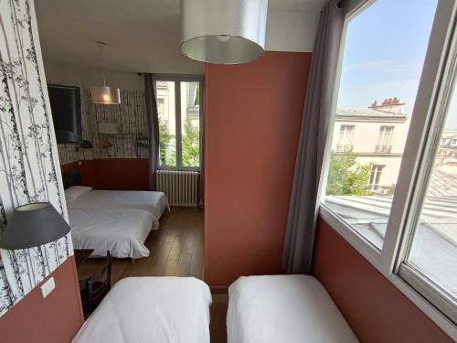 Habitación Cuádruple con baño privado del hotel Caulaincourt Montmartre By Hiphophostels. Foto 3