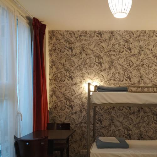 Cama Individual en habitación compartida femenina del hotel Caulaincourt Montmartre By Hiphophostels. Foto 2