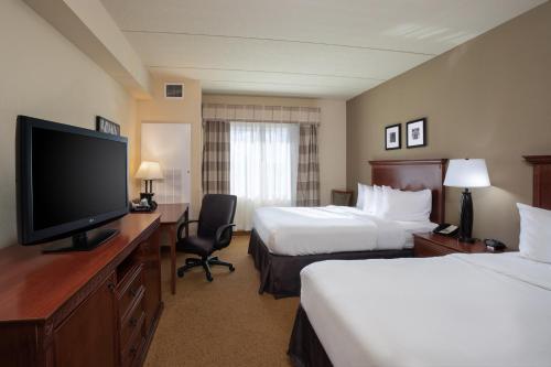Suite con sofá cama - Cama grande del hotel Country Inn & Suites by Radisson, Buffalo South I-90. Foto 1