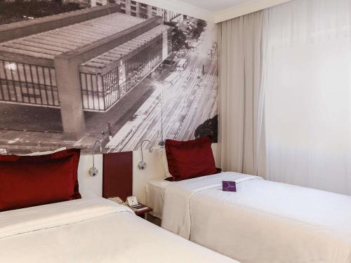 Habitación Doble Superior con balcón - 2 camas individuales del hotel Mercure São Paulo Paulista. Foto 2