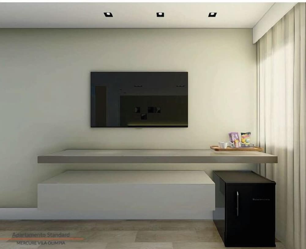 Habitación Deluxe con dos camas individuales del hotel Mercure Sao Paulo Vila Olimpia. Foto 3