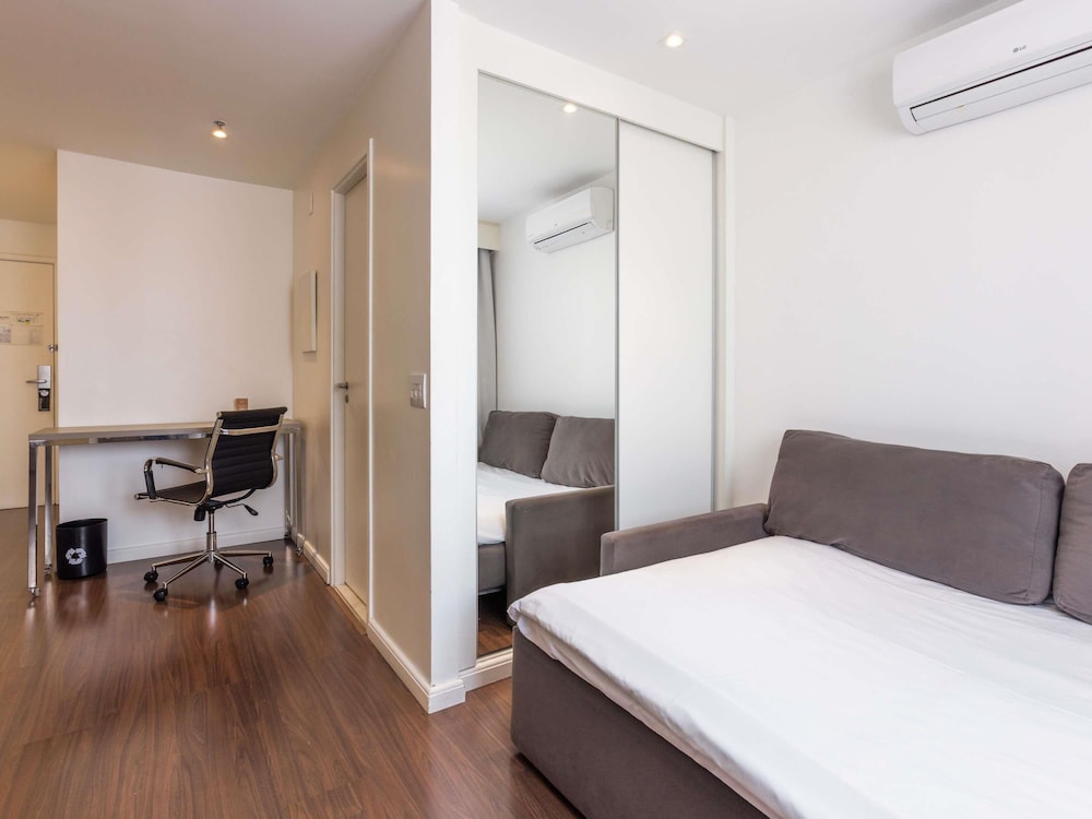 Suite Junior - 2 camas individuales + 1 sofá - cama - vistas a São Paulo del hotel Mercure Sao Paulo Vila Olimpia. Foto 13