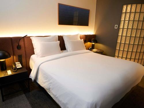 Habitación Premium Deluxe - cama grande del hotel Pullman Sao Paulo Ibirapuera. Foto 1